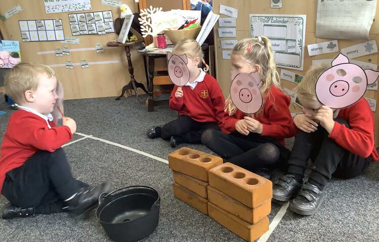 Image of Role playing the story of the three little pigs! 