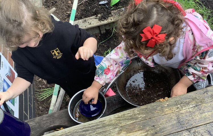 Image of Creativity in the mud kitchen! 