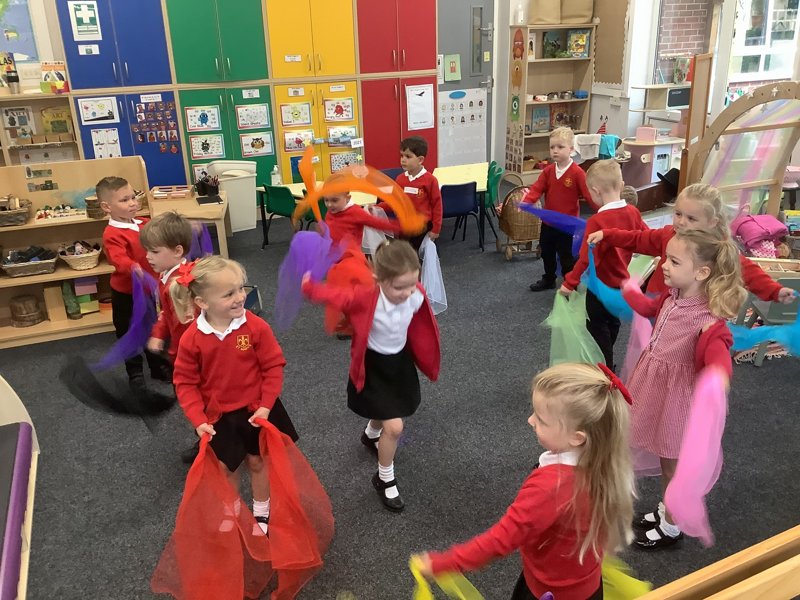 Image of Scarf dancing to develop our gross motor skills! 