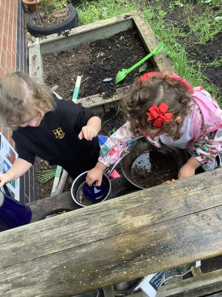 Image of Creativity in the mud kitchen! 