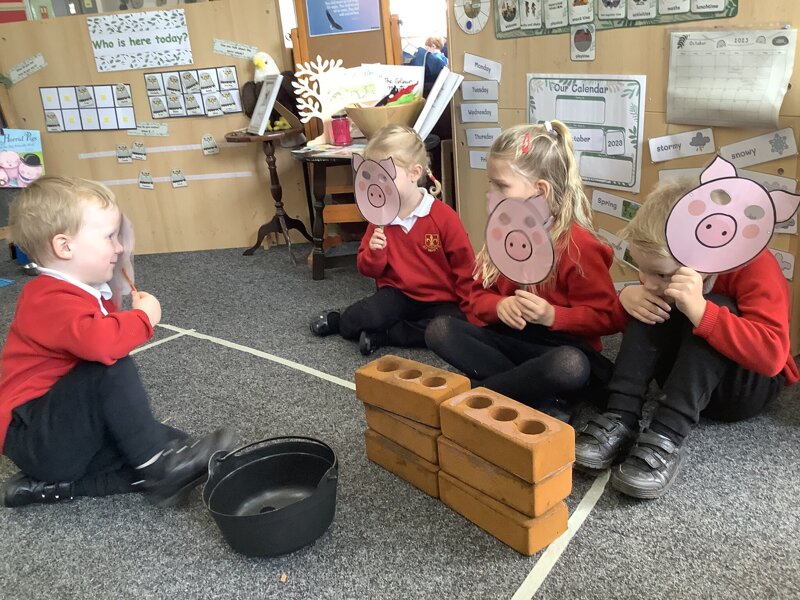 Image of Role playing the story of the three little pigs! 
